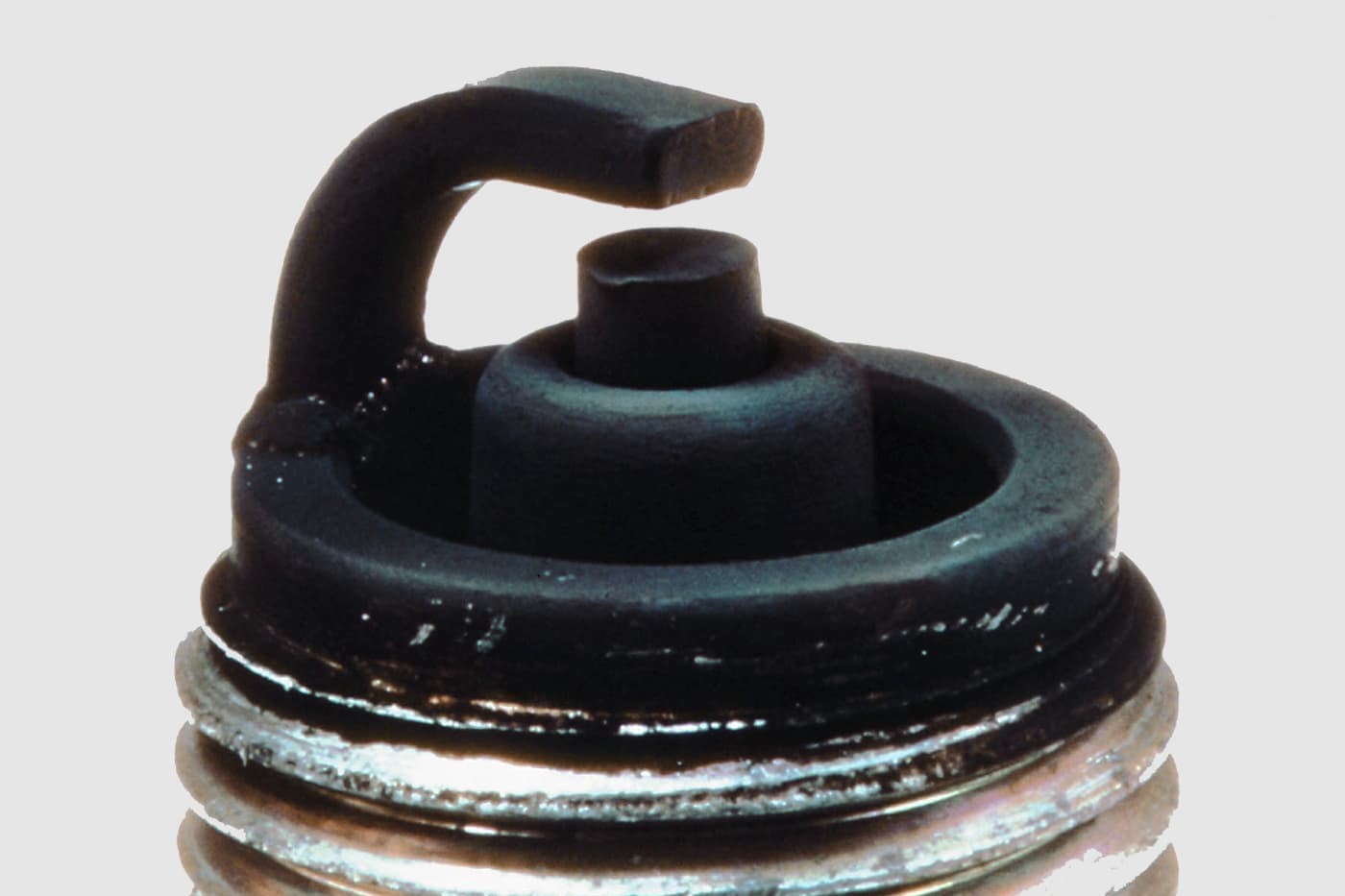 Fig. 6: Spark plug fouled with carbon