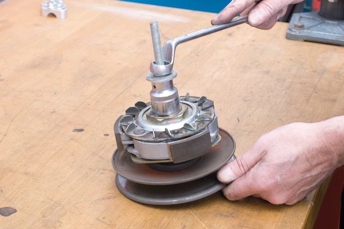 … And loosen the clutch assembly using the spindle