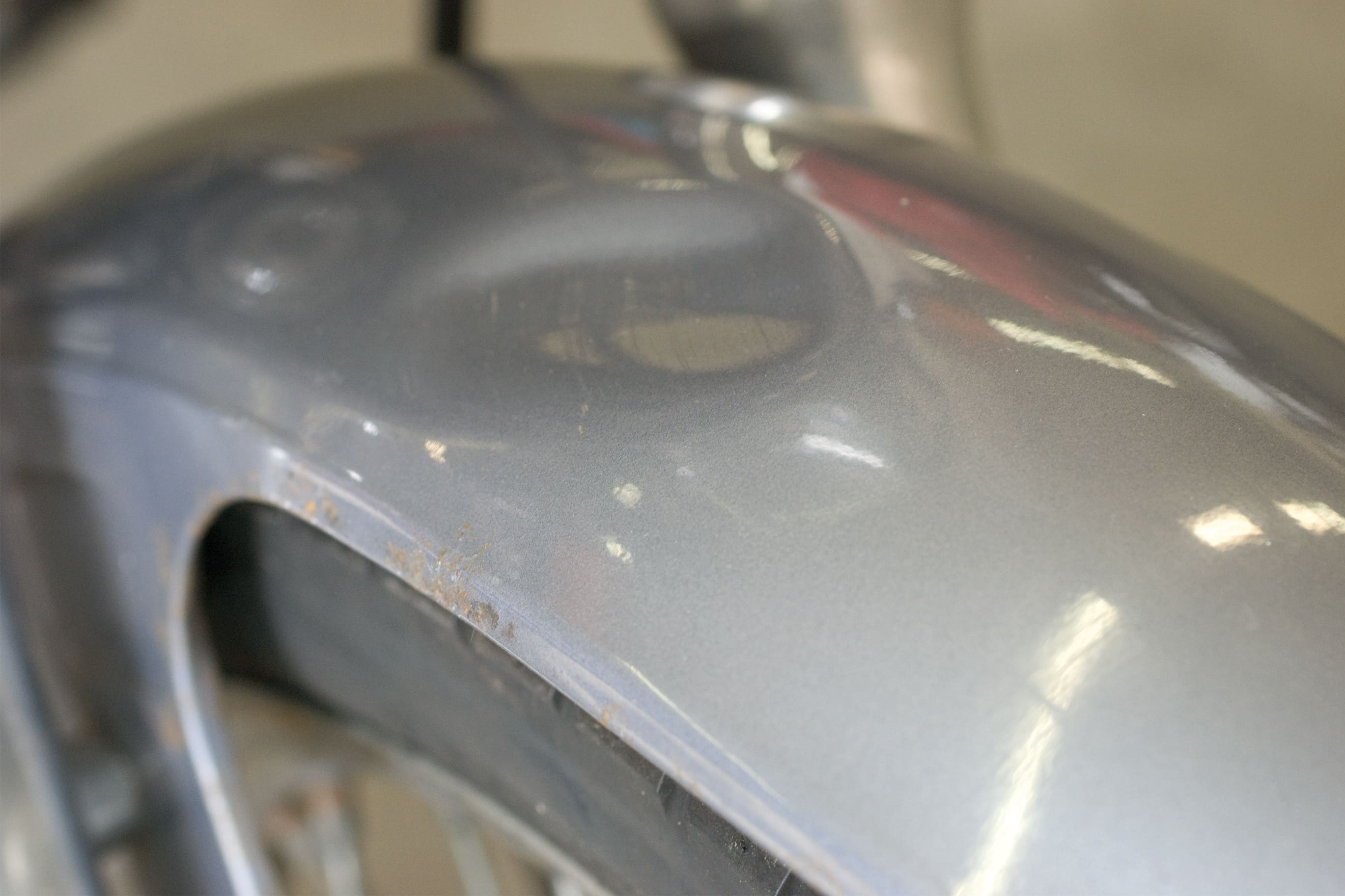    Step 1: Mudguard with dent and rust spot