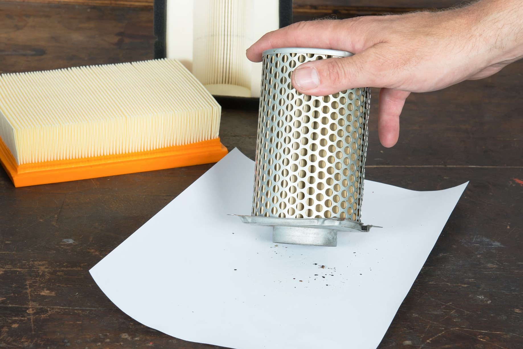 Carefully tapping out a paper air filter