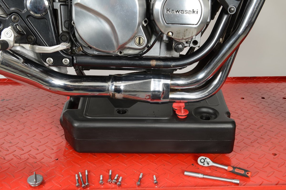 Step 1: Have tools ready – cover floor – drain oil