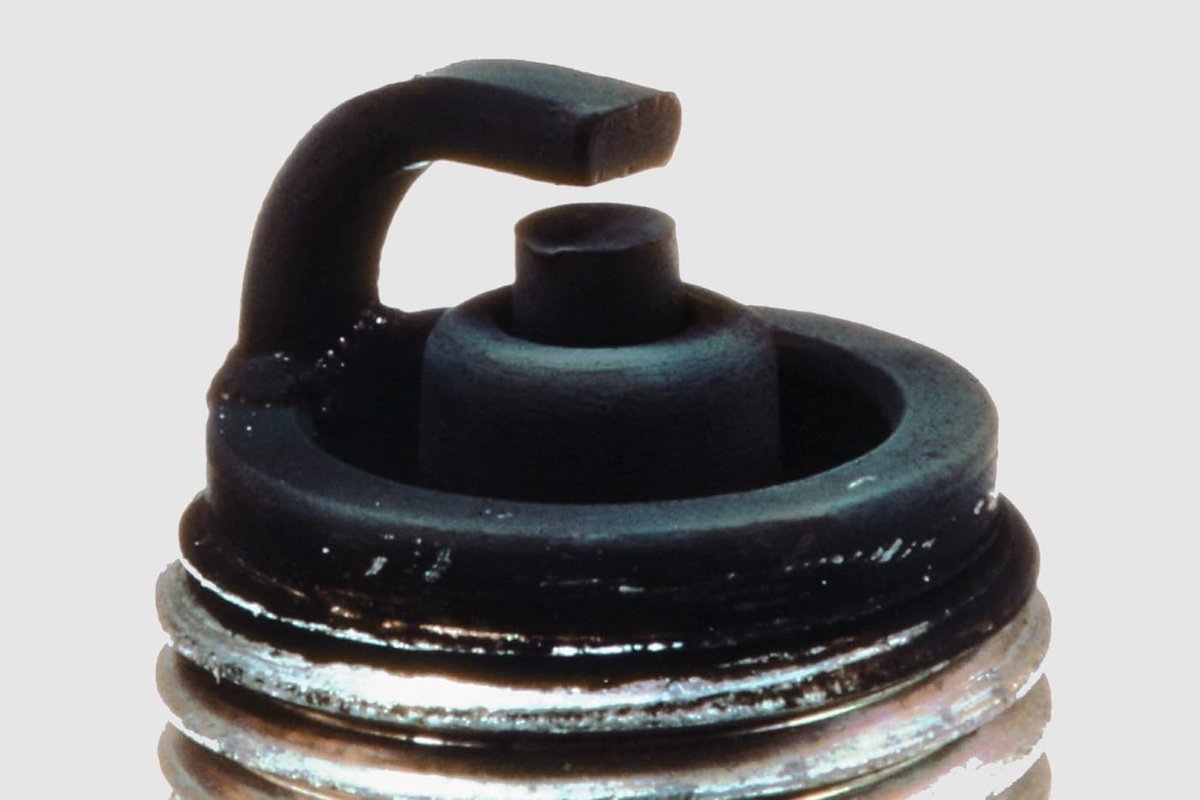 Fig. 6: Spark plug fouled with carbon
